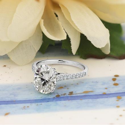 Oval Moissanite and Diamond Engagement Ring In 14K White Gold